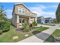 Charming two-story home with a well-manicured lawn and mature landscaping at 3128 Dark Sky Dr, Harmony, FL 34773