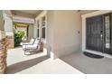 Inviting front porch with stone accents and ample space for seating at 3128 Dark Sky Dr, Harmony, FL 34773