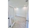 Bright and airy bedroom with tiled floors and recessed lighting, offering a clean, contemporary space at 3352 Cup Dr, Lakeland, FL 33803