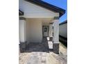 Inviting front porch with stone accents and a stylish entryway, perfect for welcoming guests at 3352 Cup Dr, Lakeland, FL 33803