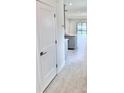 Modern kitchen with an island, grey cabinetry, tiled floors, and open-concept layout, great for entertaining at 3352 Cup Dr, Lakeland, FL 33803