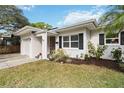 Charming single-story home with a well-manicured lawn and attached one car garage at 509 W King St, Orlando, FL 32804