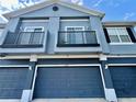 Charming townhome featuring two balconies and a one-car garage, perfect for easy parking and outdoor enjoyment at 6640 S Goldenrod Rd # 118B, Orlando, FL 32822