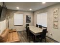 Modern dining room with a sleek concrete table, comfortable seating, and contemporary decor at 803 N Pine Hills Rd, Orlando, FL 32808