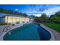 Sparkling pool area, perfect for relaxation and entertaining, surrounded by lush greenery at 2368 Summerfield Rd, Winter Park, FL 32792