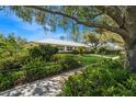 Well-maintained home featuring lush landscaping and a welcoming front yard at 2368 Summerfield Rd, Winter Park, FL 32792