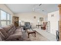 Cozy living room featuring tile flooring, a ceiling fan, and comfortable seating at 2769 E Dorchester Dr, Deltona, FL 32738