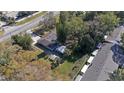 An aerial view showcases the home's location near a road and the surrounding neighborhood at 5150 Old Howell Branch Rd, Winter Park, FL 32792