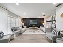 A bright, modern living room with stylish furniture, sleek flooring, and neutral decor at 5150 Old Howell Branch Rd, Winter Park, FL 32792