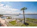 Scenic water view from the community featuring a pool, and a pier at 145 N Halifax Ave # 211, Daytona Beach, FL 32118