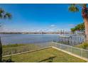 Stunning view of the wide open bay, featuring a dock and green space at 145 N Halifax Ave # 211, Daytona Beach, FL 32118