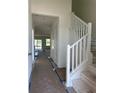 Inviting entryway showcasing a staircase and an open floor plan, great for welcoming guests at 3165 Cup Dr, Lakeland, FL 33803