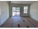 Spacious living room featuring a sliding glass door and large window, perfect for relaxing at 3165 Cup Dr, Lakeland, FL 33803