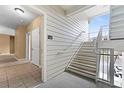Exterior stairway leading to the upper levels of the apartment building, showcasing outdoor access at 3176 Feltrim Pl # 205, Kissimmee, FL 34747