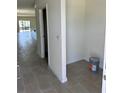 Bright entryway with tile flooring and view of open-concept layout at 3225 Cup Dr, Lakeland, FL 33803