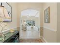Open-concept living room showcasing tiled floors, neutral walls, and abundant natural light at 325 Bellingrath Terrace, Deland, FL 32724