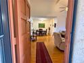 View into the home featuring hardwood flooring, formal dining area, and comfortable living room at 370 N Windmeadows St # 370, Altamonte Springs, FL 32701
