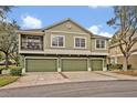 Attractive townhome featuring a three car garage, landscaped surroundings, and pleasant curb appeal at 466 Ashley Brooke Ct # C, Apopka, FL 32712