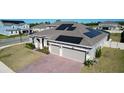 Charming single-Gathering home featuring a two-car garage, solar panels and a well-manicured lawn at 4897 Gilded Jewel Dr, Mount Dora, FL 32757