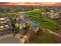 Beautiful community with golf course views, lush landscaping, and elegant homes with well-manicured lawns at 1432 Titian Ct, Reunion, FL 34747