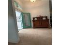 Foyer with tile flooring, stained glass, and decorative cabinet at 1733 Weeping Elm Cir, Port Orange, FL 32128