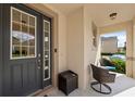 Inviting front porch with seating area, perfect for relaxing outdoors at 1841 Sawyer Palm Pl, Kissimmee, FL 34747