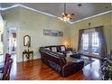Inviting living room with hardwood floors, a ceiling fan, recessed lighting, and french doors at 290 Thomas Dr, Casselberry, FL 32707