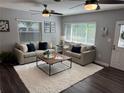 Comfortable living room with a plush rug, neutral furniture, and natural lighting at 2909 Depauw Ave, Orlando, FL 32804