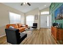 Spacious living room with vaulted ceilings, neutral walls, and modern furnishings, creating a cozy atmosphere at 131 Sonja Cir # 1, Davenport, FL 33897