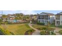 Aerial view showcasing community amenities, including a pool and green spaces at 1763 White Feather Loop, Oakland, FL 34787