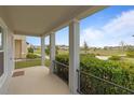 Inviting front porch view, perfect for relaxing and enjoying the outdoor scenery at 1763 White Feather Loop, Oakland, FL 34787
