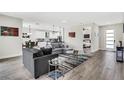 Comfortable living room flows into the modern kitchen, featuring stylish decor and ample natural light at 2160 7Th Ave, Deland, FL 32724
