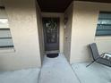 Inviting front door with wreath and decorations adding charm to the home's entrance at 2284 Firestone Pl, Winter Haven, FL 33884