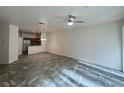 Open-concept living room with tile flooring and ceiling fan at 2946 Ashland S Ln, Kissimmee, FL 34741
