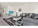 Comfortable living room with tile flooring, neutral paint, and lots of natural light at 425 Singing Sands Cir, Lake Wales, FL 33859