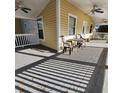 Spacious porch with ceiling fans and outdoor seating, great for relaxing at 615 S Laurel Ave, Sanford, FL 32771