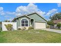 Charming one-story home featuring a two-car garage and well-maintained front lawn at 8519 Rainbow Ave, Orlando, FL 32825