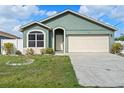 Charming one-story home featuring a two-car garage and well-maintained front lawn at 8519 Rainbow Ave, Orlando, FL 32825