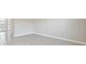 Minimalist living room with tile floors and base trim, perfect for modern decor and easy upkeep at 1412 Captiva Cv, Sanford, FL 32771