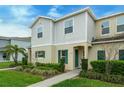 Well-maintained two-story home with lush lawn, neat landscaping, and inviting front entrance at 157 Primrose Dr, Davenport, FL 33837