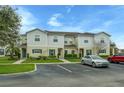 View of multi-Gathering home and parking area showing well maintained landscaping and exterior features at 157 Primrose Dr, Davenport, FL 33837