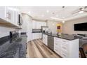 Modern kitchen featuring stainless steel appliances, granite countertops, and white cabinets at 1965 3Rd Dr, Sanford, FL 32771
