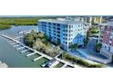 Waterfront condo building with private boat slips and easy access to the water, perfect for boating enthusiasts at 3 Riverwalk Dr # 506, New Smyrna Beach, FL 32169