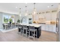 Open kitchen featuring a center island with bar seating, pendant lights, and modern stainless appliances at 3110 Norcott Dr, Davenport, FL 33837