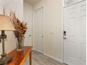 Bright entryway with light-colored tile flooring and white doors at 3412 Yellowtop Loop, Clermont, FL 34714