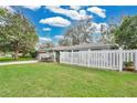 Well maintained single Gathering home featuring a lush, green lawn and a white picket fence at 4522 Flagg St, Orlando, FL 32812