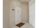 A welcoming entrance features a white door with unit number, creating a clean and inviting first impression at 4849 Cypress Woods Dr # 1308, Orlando, FL 32811