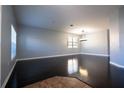 Spacious living room with dark wood floors, gray walls, and neutral trim at 535 Belle Fern Ct, Ocoee, FL 34761