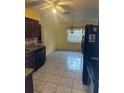 Eat-in kitchen features tile floors and stainless steel appliances at 5815 Holmes Dr, Orlando, FL 32808