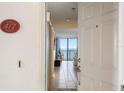 Condo entryway showing the door with a view straight through to the ocean at 6727 Turtlemound Rd # 417, New Smyrna Beach, FL 32169